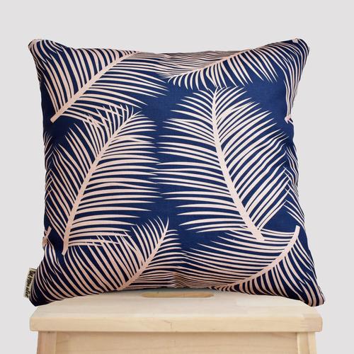 This stunning cotton linen cushion designed and made in England comes in a soft tropical pattern in trendy blush pink on navy blue for the perfect tropical addition to your home.